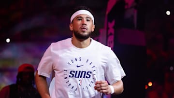 Oct 26, 2024; Phoenix, Arizona, USA; Phoenix Suns guard Devin Booker (1) against the Dallas Mavericks in the home opener at Footprint Center. Mandatory Credit: Mark J. Rebilas-Imagn Images