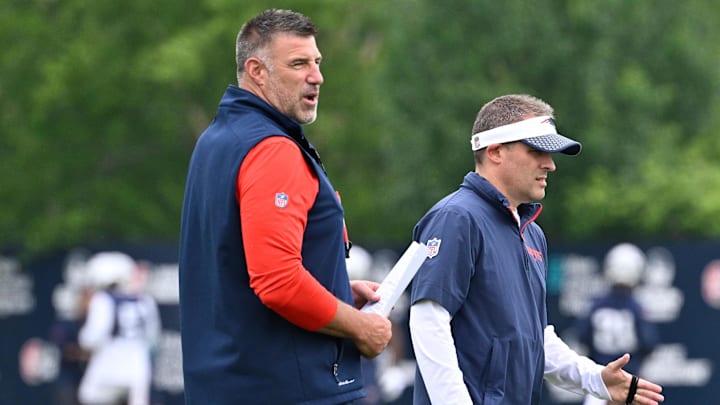 Jun 9, 2025; Foxborough, MA, USA; New England Patriots head coach Mike Vrabel (L) and offensive coordinator Josh McDaniels (R) watch over practice during minicamp at Gillette Stadium. Mandatory Credit: Eric Canha-Imagn Images