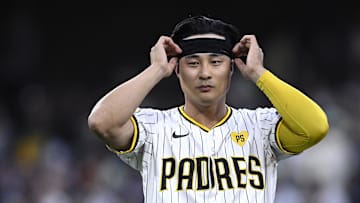 Jun 20, 2024; San Diego, California, USA; San Diego Padres shortstop Ha-Seong Kim (7) adjusts his headband during the fourth inning against the Milwaukee Brewers at Petco Park. Mandatory Credit: Orlando Ramirez-Imagn Images