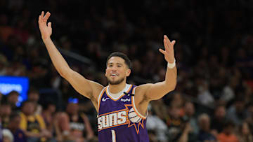 Apr 8, 2025; Phoenix, Arizona, USA; Phoenix Suns guard Devin Booker (1) reacts against the Golden State Warriors during the second half at Footprint Center. Mandatory Credit: Mark J. Rebilas-Imagn Images