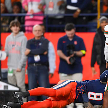Nov 30, 2024; Syracuse, New York, USA; Syracuse Orange defensive back Justin Barron (8) attempts to sack Miami Hurricanes quarterback Cam Ward (1) during the second half at the JMA Wireless Dome. Mandatory Credit: Rich Barnes-Imagn Images