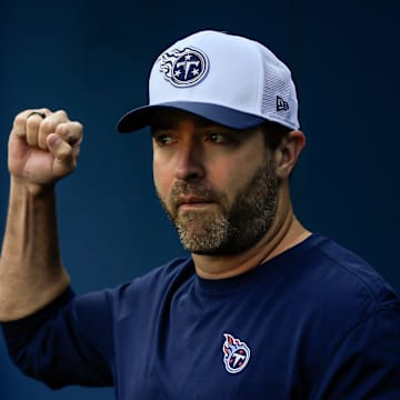 Aug 10, 2024; Nashville, Tennessee, USA;  Tennessee Titans head coach Brian Callahan holds up his fist as he takes the field during the first half at Nissan Stadium. Mandatory Credit: Steve Roberts-Imagn Images