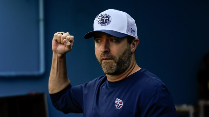 Aug 10, 2024; Nashville, Tennessee, USA;  Tennessee Titans head coach Brian Callahan holds up his fist as he takes the field during the first half at Nissan Stadium. Mandatory Credit: Steve Roberts-USA TODAY Sports