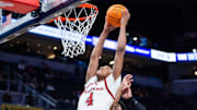 Mar 12, 2025; Indianapolis, IN, USA; Rutgers Scarlet Knights guard Ace Bailey (4) shoots the ball while USC Trojans guard Chibuzo Agbo (7) defends in the second half at Gainbridge Fieldhouse. Mandatory Credit: Trevor Ruszkowski-Imagn Images