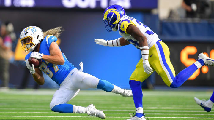 Aug 17, 2024; Inglewood, California, USA; Los Angeles Chargers wide receiver Simi Fehoko (87) catches a pass ahead of Los Angeles Rams safety Jaylen McCollough (39) during the first half at SoFi Stadium. Mandatory Credit: Gary A. Vasquez-USA TODAY Sports