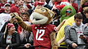 Oct 23, 2021; Pullman, Washington, USA; Washington State Cougars mascot Butch stand with the student section during a game against the Brigham Young Cougars in the first half at Gesa Field at Martin Stadium. Mandatory Credit: James Snook-Imagn Images