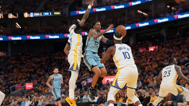 Apr 15, 2025; San Francisco, California, USA; Memphis Grizzlies guard Ja Morant (12) drives to the hoop between Golden State Warriors guard Gary Payton II (0) and forward Jimmy Butler III (10) in the second quarter at the Chase Center. Mandatory Credit: Cary Edmondson-Imagn Images Apr 15, 2025; San Francisco, California, USA; Memphis Grizzlies guard Ja Morant (12) drives to the hoop between Golden State Warriors guard Gary Payton II (0) and forward Jimmy Butler III (10) in the second quarter at the Chase Center. Mandatory Credit: Cary Edmondson-Imagn Images