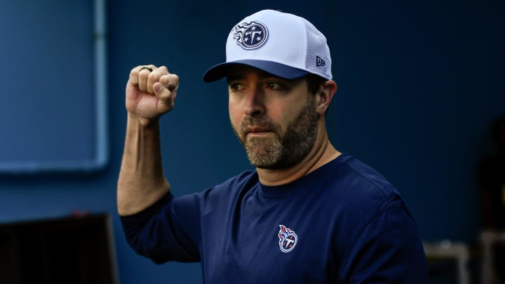 Aug 10, 2024; Nashville, Tennessee, USA; Tennessee Titans head coach Brian Callahan holds up his fist as he takes the field during the first half at Nissan Stadium