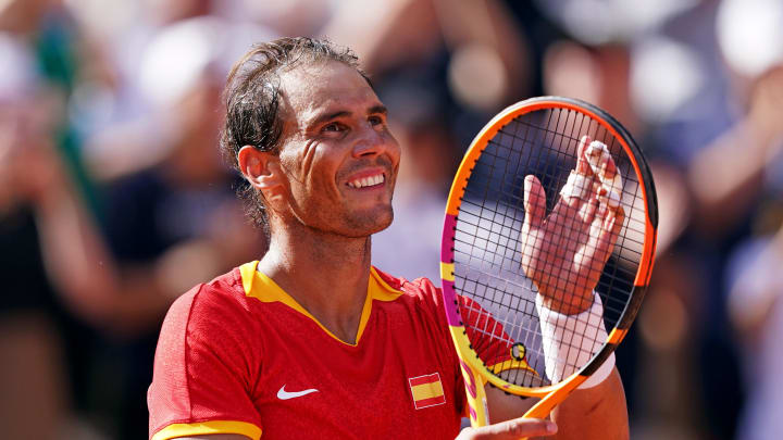 Jul 28, 2024; Paris, France; Rafael Nadal (ESP) celebrates after his match against Marton Fucsovics (HUN) in the men’s tennis singles first round during the Paris 2024 Olympic Summer Games at Stade Roland Garros. 