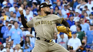 Oct 1, 2025; Chicago, Illinois, USA; San Diego Padres pitcher Robert Suarez (75) delivers during game two of the Wildcard round for the 2025 MLB playoffs at Wrigley Field. Mandatory Credit: Matt Marton-Imagn Images