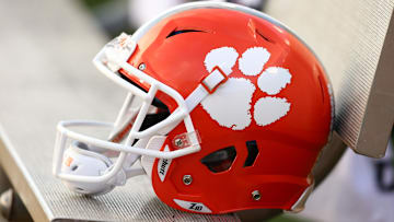 A Clemson Tigers helmet sits on the bench