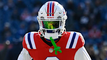 Dec 1, 2024; Foxborough, Massachusetts, USA; New England Patriots cornerback Christian Gonzalez (0) warms up before a game against the Indianapolis Colts at Gillette Stadium. Mandatory Credit: Eric Canha-Imagn Images