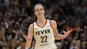 May 24, 2024; Los Angeles, California, USA;  Indiana Fever guard Caitlin Clark (22) smiles as she heads down court after a 3-point basket in the final seconds of the game against the Los Angeles Sparks at Crypto.com Arena. Mandatory Credit: Jayne Kamin-Oncea-Imagn Images
