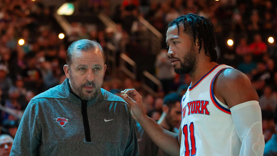New York Knicks head coach Tom Thibodeau with guard Jalen Brunson (11) against the Phoenix Suns at Footprint Center. | Mark J. Rebilas-Imagn Images