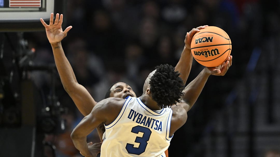 Mar 19, 2026; Portland, OR, USA; Texas Longhorns guard Tramon Mark (12) blocks BYU Cougars forward AJ Dybantsa (3) in the second half during a first round game of the men's 2026 NCAA Tournament at Moda Center. Mandatory Credit: Craig Strobeck-Imagn Images