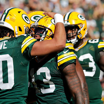 Green Bay Packers quarterback Jordan Love (10) and Dontayvion Wicks (13) celebrate a touchdown reception against the Minnesota Vikings during their football game Sunday, September 29, 2024, at Lambeau Field in Green Bay, Wisconsin.