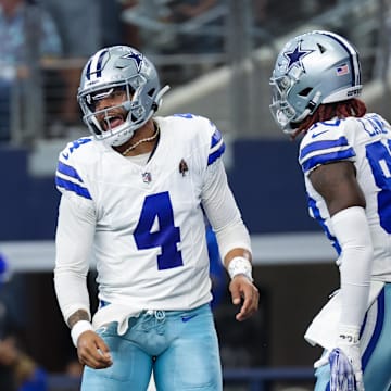 Dallas Cowboys quarterback Dak Prescott (4) celebrates with Dallas Cowboys wide receiver CeeDee Lamb (88)