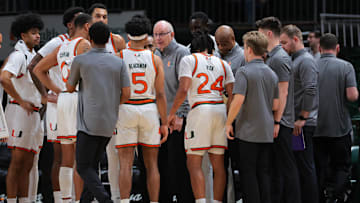 Dec 7, 2024; Coral Gables, Florida, USA; Miami Hurricanes head coach Jim Larranaga talks to his players during a timeline against the Clemson Tigers in the first half at Watsco Center. Mandatory Credit: Sam Navarro-Imagn Images