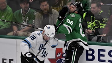 Apr 12, 2025; Dallas, Texas, USA; Dallas Stars center Mavrik Bourque (22) reacts after he is hit by the high stick of Utah Hockey Club defenseman Ian Cole (28) during the first period at the American Airlines Center. Mandatory Credit: Jerome Miron-Imagn Images