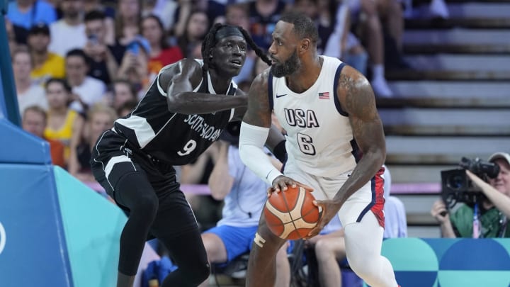 Jul 31, 2024; Villeneuve-d'Ascq, France; United States guard Lebron James (6) dribbles against South Sudan power forward Wenyen Gabriel (9) in the second quarter during the Paris 2024 Olympic Summer Games at Stade Pierre-Mauroy. Mandatory Credit: John David Mercer-USA TODAY Sports