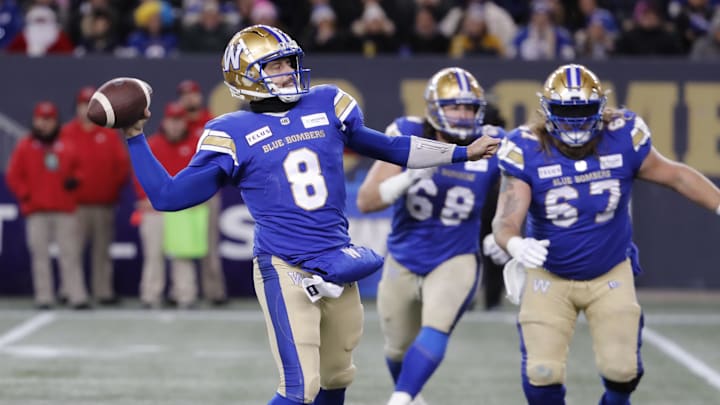 Nov 11, 2023; Winnipeg, Manitoba, CAN;  Winnipeg Blue Bombers quarterback Zach Collaros (8) looks downfield for a receiver during the first half of the game against the BC Lions at IG Field. Mandatory Credit: Bruce Fedyck-Imagn Images