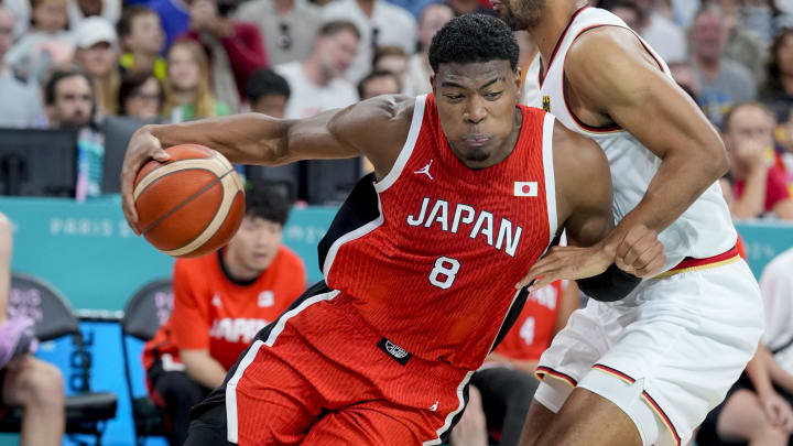 Jul 27, 2024; Villeneuve-d'Ascq, France; Japan small forward Rui Hachimura (8) pushes past Germany power forward Johannes Thiemann (32) during the Paris 2024 Olympic Summer Games at Stade Pierre-Mauroy. Mandatory Credit: John David Mercer-USA TODAY Sports