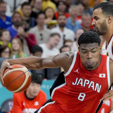 Jul 27, 2024; Villeneuve-d'Ascq, France; Japan small forward Rui Hachimura (8) pushes past Germany power forward Johannes Thiemann (32) during the Paris 2024 Olympic Summer Games at Stade Pierre-Mauroy. Mandatory Credit: John David Mercer-USA TODAY Sports