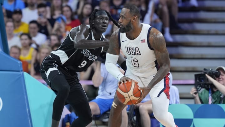 Jul 31, 2024; Villeneuve-d'Ascq, France; United States foward Lebron James (6) dribbles against South Sudan power forward Wenyen Gabriel (9) in the second quarter during the Paris 2024 Olympic Summer Games at Stade Pierre-Mauroy. Mandatory Credit: John David Mercer-USA TODAY Sports