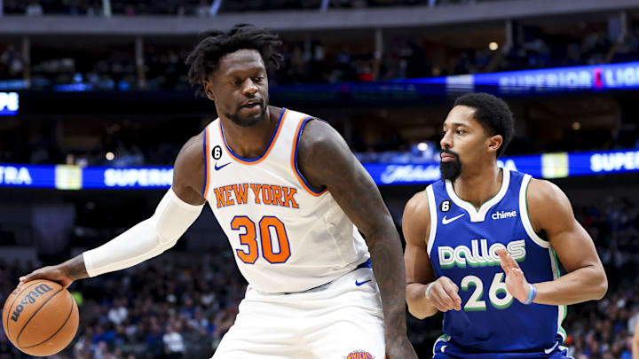 Dec 27, 2022; Dallas, Texas, USA;  New York Knicks forward Julius Randle (30) dribbles as Dallas Mavericks guard Spencer Dinwiddie (26) defends during the first quarter at American Airlines Center. Mandatory Credit: Kevin Jairaj-Imagn Images