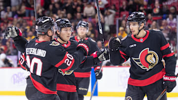 Nov 13, 2025; Ottawa, Ontario, CAN; Ottawa Senators center Dylan Cozens (24) celebrates with left wing Fabian Zetterlund (20) and defenseman Jordan Spence (10) after scoring in the first period against the Boston Bruins at the Canadian Tire Centre. Mandatory Credit: Marc DesRosiers-IMAGN Images