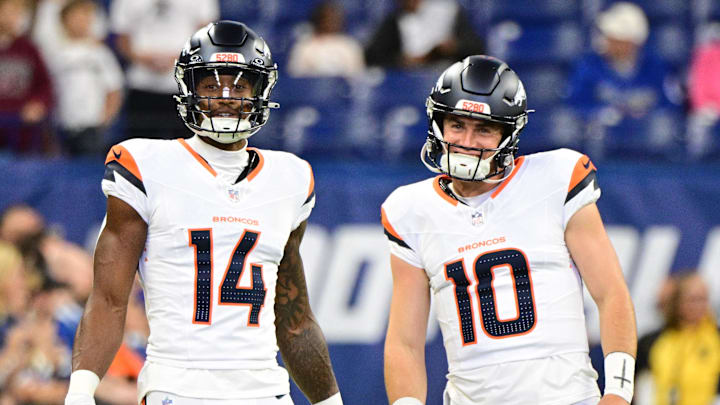 Aug 11, 2024; Indianapolis, Indiana, USA; Denver Broncos wide receiver Courtland Sutton (14) and quarterback Bo Nix (10) stand on the field during warm ups before the game against the Indianapolis Colts at Lucas Oil Stadium. Mandatory Credit: Marc Lebryk-Imagn Images