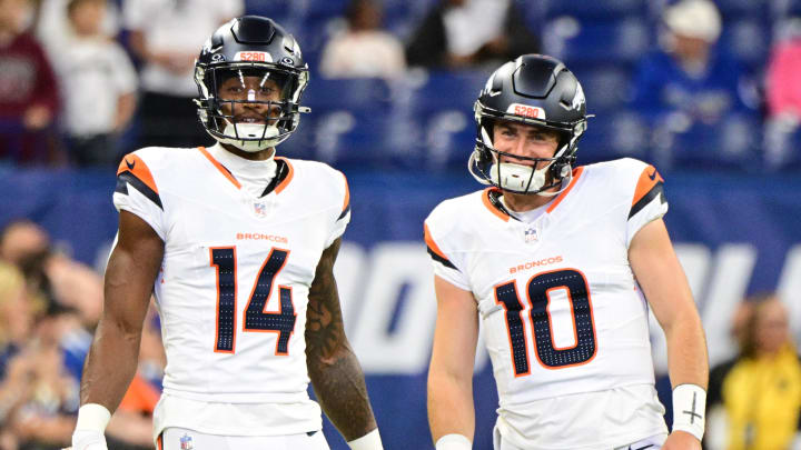 Aug 11, 2024; Indianapolis, Indiana, USA; Denver Broncos wide receiver Courtland Sutton (14) and quarterback Bo Nix (10) stand on the field during warm ups before the game against the Indianapolis Colts at Lucas Oil Stadium. 