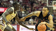 Mar 9, 2024; Tallahassee, Florida, USA; Miami Hurricanes guard Matthew Cleveland (right) drives to the basket against Florida State Seminoles forward Taylor Bol Bowen (10) during the second half at Donald L. Tucker Center. Mandatory Credit: Melina Myers-Imagn Images