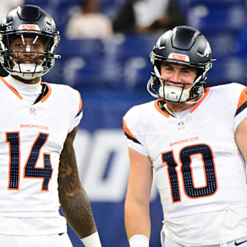 Aug 11, 2024; Indianapolis, Indiana, USA; Denver Broncos wide receiver Courtland Sutton (14) and quarterback Bo Nix (10) stand on the field during warm ups before the game against the Indianapolis Colts at Lucas Oil Stadium. 