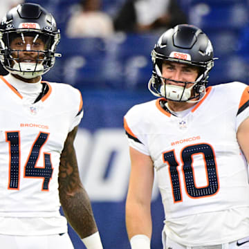 Aug 11, 2024; Indianapolis, Indiana, USA; Denver Broncos wide receiver Courtland Sutton (14) and quarterback Bo Nix (10) stand on the field during warm ups before the game against the Indianapolis Colts at Lucas Oil Stadium. 