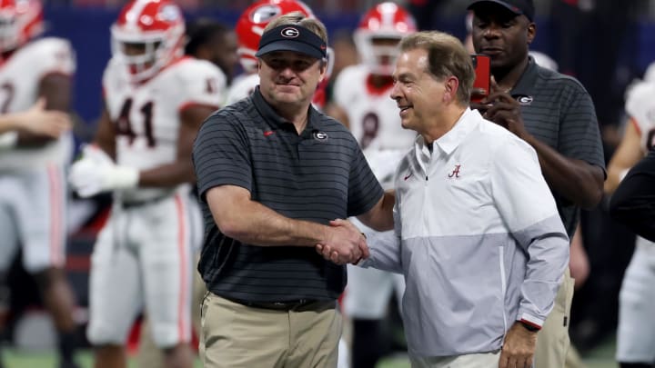 Dec 4, 2021; Atlanta, GA, USA; Georgia Bulldogs head coach Kirby Smart greets Alabama Crimson Tide head coach Nick Saban before the SEC championship game at Mercedes-Benz Stadium. Mandatory Credit: Jason Getz-USA TODAY Sports