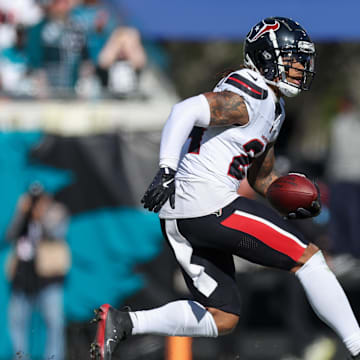 Dec 1, 2024; Jacksonville, Florida, USA; Houston Texans cornerback Derek Stingley Jr. (24) runs with the ball against the Jacksonville Jaguars in the second quarter at EverBank Stadium. Mandatory Credit: Nathan Ray Seebeck-Imagn Images