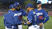 Mar 14, 2018; Phoenix, AZ, USA; Los Angeles Dodgers manager Dave Roberts (30), right fielder Yasiel Puig (66), third baseman Justin Turner (10) and first baseman Cody Bellinger (35) talk on the field prior to the game against the Colorado Rockies at Camelback Ranch. Mandatory Credit: Joe Camporeale-Imagn Images