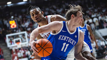 eFeb 22, 2025; Tuscaloosa, Alabama, USA; Kentucky Wildcats guard Travis Perry (11) drives the ball against Alabama Crimson Tide forward Jarin Stevenson (15) during the second half at Coleman Coliseum. Mandatory Credit: Will McLelland-Imagn Images