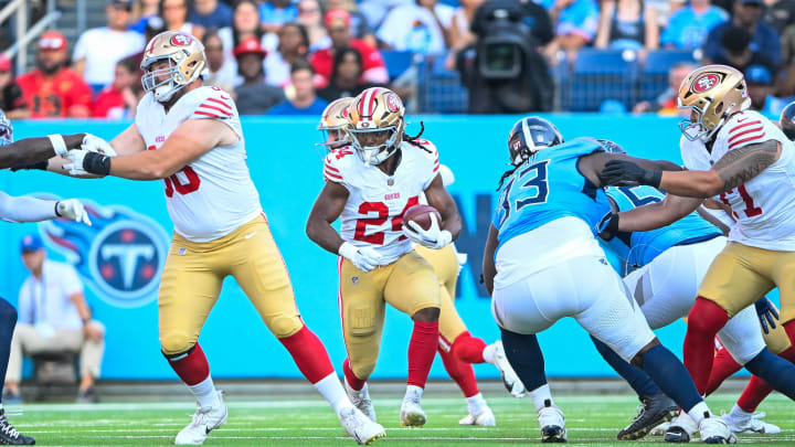 Aug 10, 2024; Nashville, Tennessee, USA;  San Francisco 49ers running back Jordan Mason (24) runs the ball against the Tennessee Titans during the first half at Nissan Stadium. Mandatory Credit: Steve Roberts-USA TODAY Sports