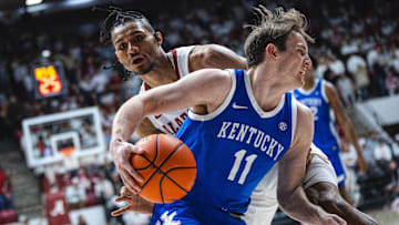 eFeb 22, 2025; Tuscaloosa, Alabama, USA; Kentucky Wildcats guard Travis Perry (11) drives the ball against Alabama Crimson Tide forward Jarin Stevenson (15) during the second half at Coleman Coliseum. Mandatory Credit: Will McLelland-Imagn Images