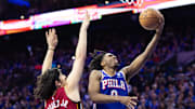 Apr 17, 2024; Philadelphia, Pennsylvania, USA; Philadelphia 76ers guard Tyrese Maxey (0) drives for a score past Miami Heat guard Jaime Jaquez Jr. (11) during the fourth quarter of a play-in game of the 2024 NBA playoffs at Wells Fargo Center. Mandatory Credit: Bill Streicher-Imagn Images