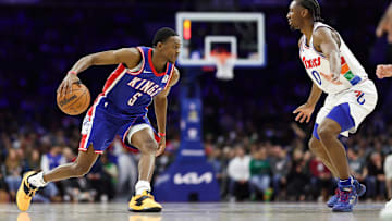 Jan 29, 2025; Philadelphia, Pennsylvania, USA; Sacramento Kings guard De'Aaron Fox (5) controls the ball in front of Philadelphia 76ers guard Tyrese Maxey (0) during the second quarter at Wells Fargo Center. Mandatory Credit: Bill Streicher-Imagn Images