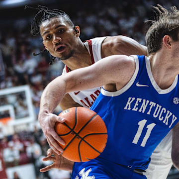 eFeb 22, 2025; Tuscaloosa, Alabama, USA; Kentucky Wildcats guard Travis Perry (11) drives the ball against Alabama Crimson Tide forward Jarin Stevenson (15) during the second half at Coleman Coliseum. Mandatory Credit: Will McLelland-Imagn Images