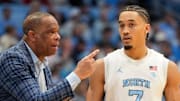 Feb 22, 2025; Chapel Hill, North Carolina, USA; North Carolina Tar Heels head coach Hubert Davis talks to guard Seth Trimble (7) in the first half at Dean E. Smith Center. Mandatory Credit: Bob Donnan-Imagn Images