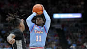 Dec 20, 2024; Cincinnati, Ohio, USA;  Dayton Flyers guard Malachi Smith (11) shoots against Cincinnati Bearcats guard Jizzle James (2) in the first half at Heritage Bank Center. Mandatory Credit: Aaron Doster-Imagn Images