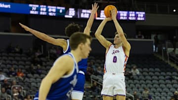 Evansville's Gabriel Pozzato (0) takes a shot as the Evansville Purple Aces play the Drake Bulldogs at Ford Center in Evansville, Ind., Wednesday, Feb. 26, 2025.