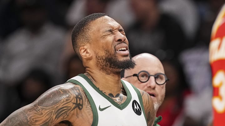 Mar 4, 2025; Atlanta, Georgia, USA; Milwaukee Bucks guard Damian Lillard (0) reacts after being injured against the Atlanta Hawks during the first half at State Farm Arena. Mandatory Credit: Dale Zanine-Imagn Images