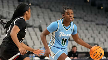 Mar 6, 2023; Fort Worth, TX, USA; Tulane Green Wave guard Kyren Whittington (0) controls the ball against Cincinnati Bearcats guard Mya Jackson (23) during the first half at Dickies Arena. 