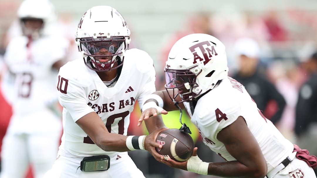 Texas A&M Aggies quarterback Marcel Reed and running back Rueben Owens II warm up before the game against the Arkansas Razorbacks at Donald W. Reynolds Razorback Stadium.